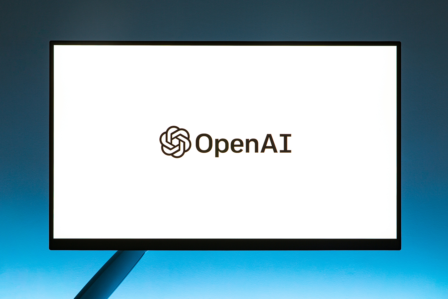 Monitor screen displaying OpenAI logo