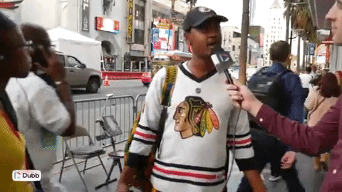 A man being interviewed on the street